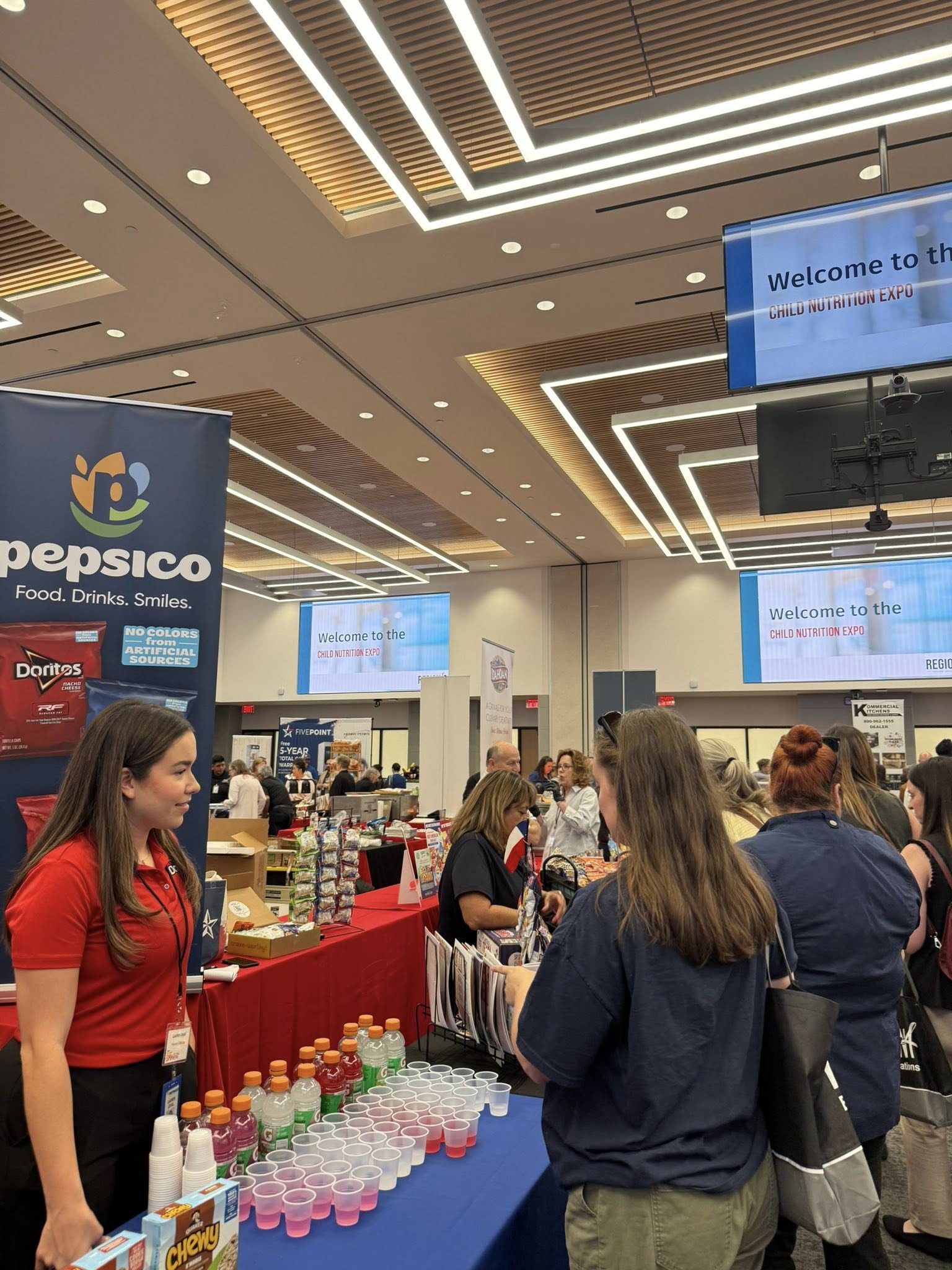 Vendor sharing products with Child Nutrition Expo attendees
