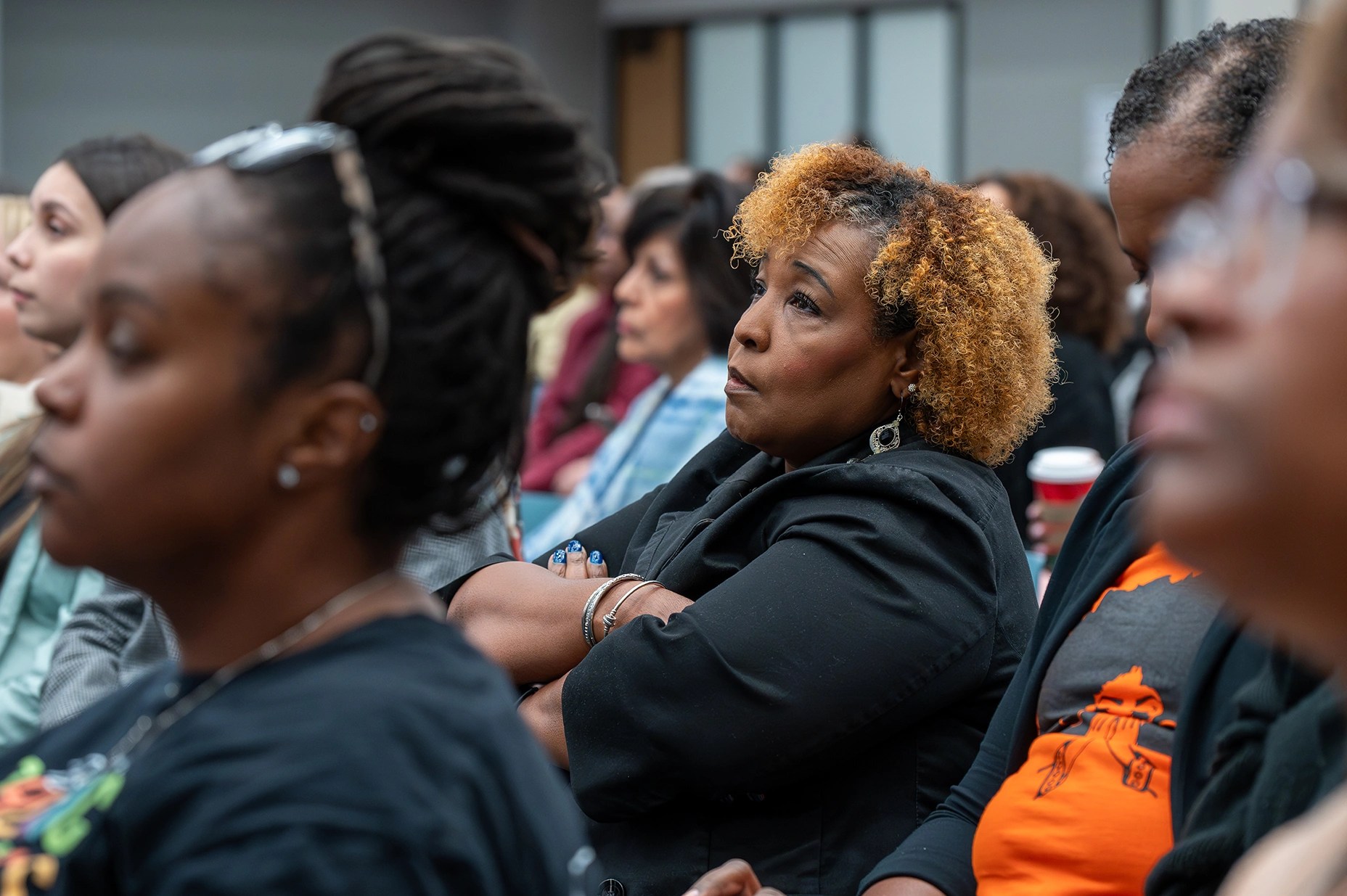 Educators participating in conference learning
